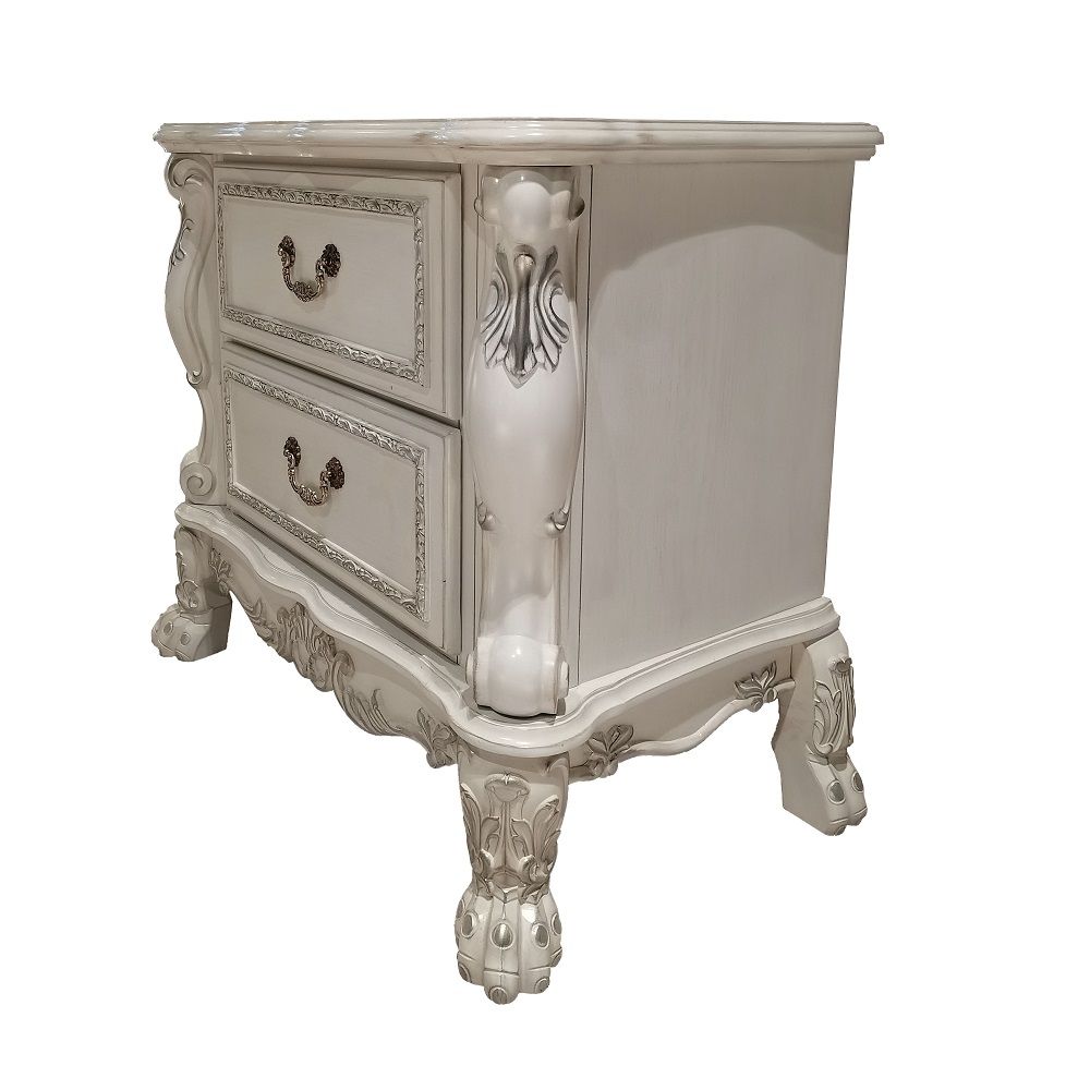 ACME The Dresden Nightstand offers beautiful craftsmanship and artistic carvings. It features solid hardwood with two drawers for storage with coordinating carvings. The drawers feature dove tail construction and are decorated with antique brass hardware.