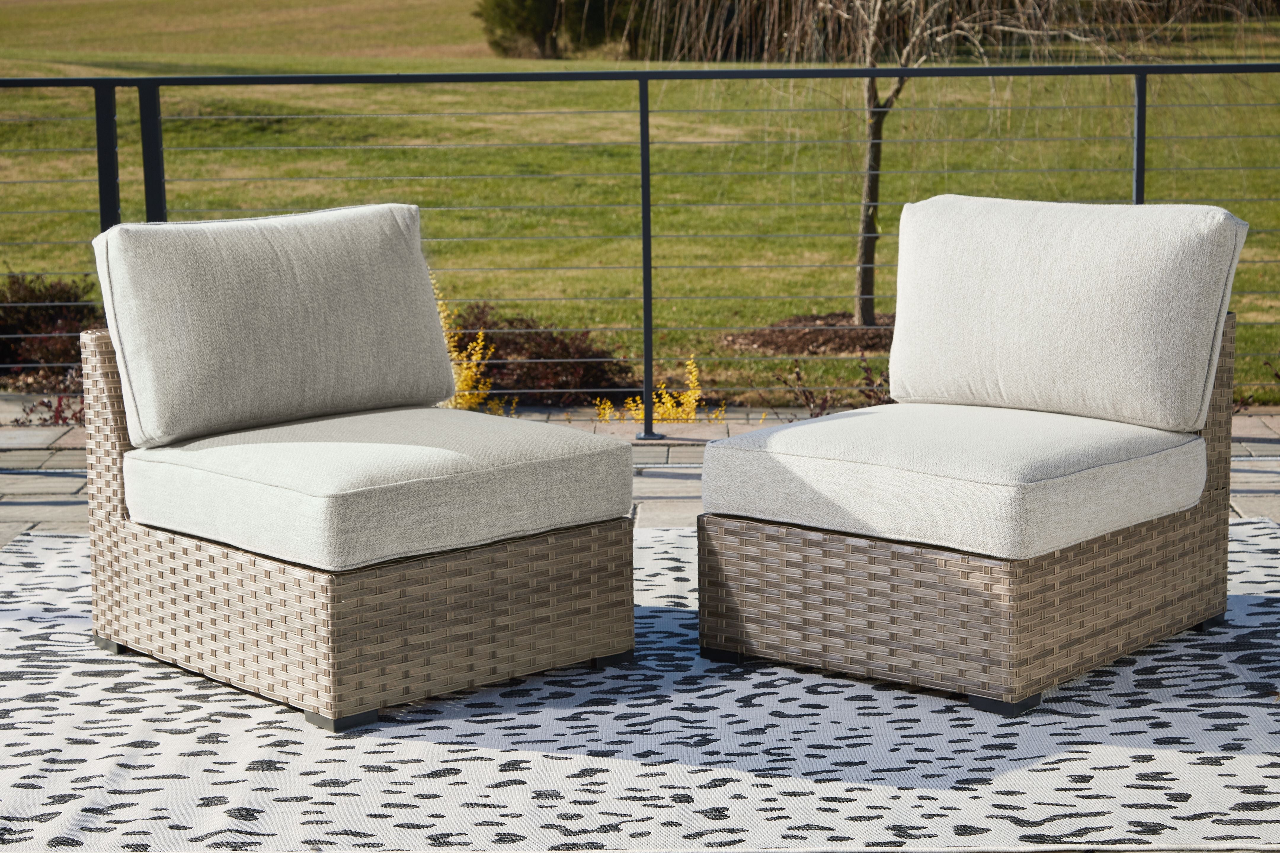 Ashley Furniture Calworth - Beige - Armless Chair W/Cushion (Set of 2) | Meri Furniture