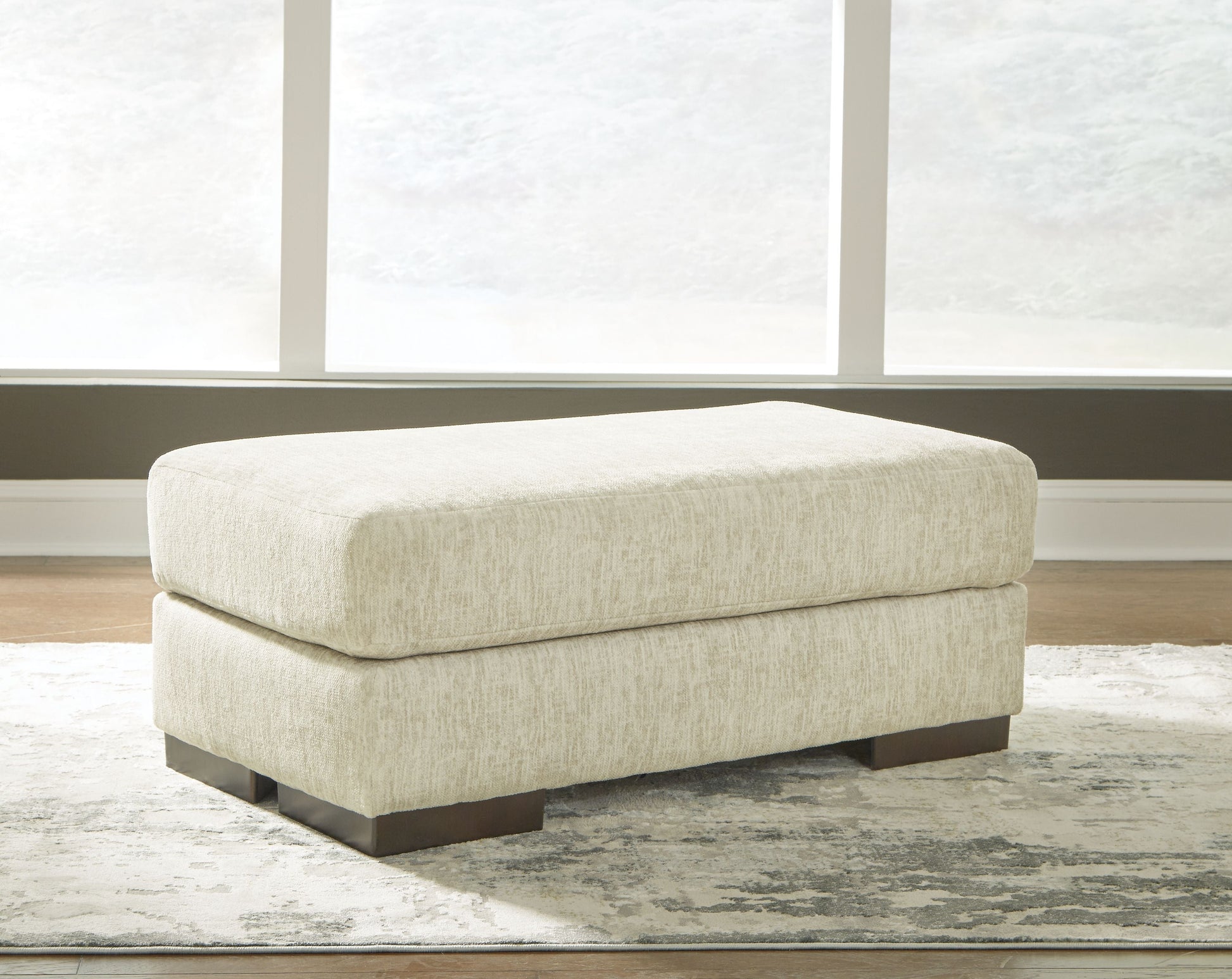 Signature Design by Ashley® Caretti - Parchment - Ottoman | Meri Furniture