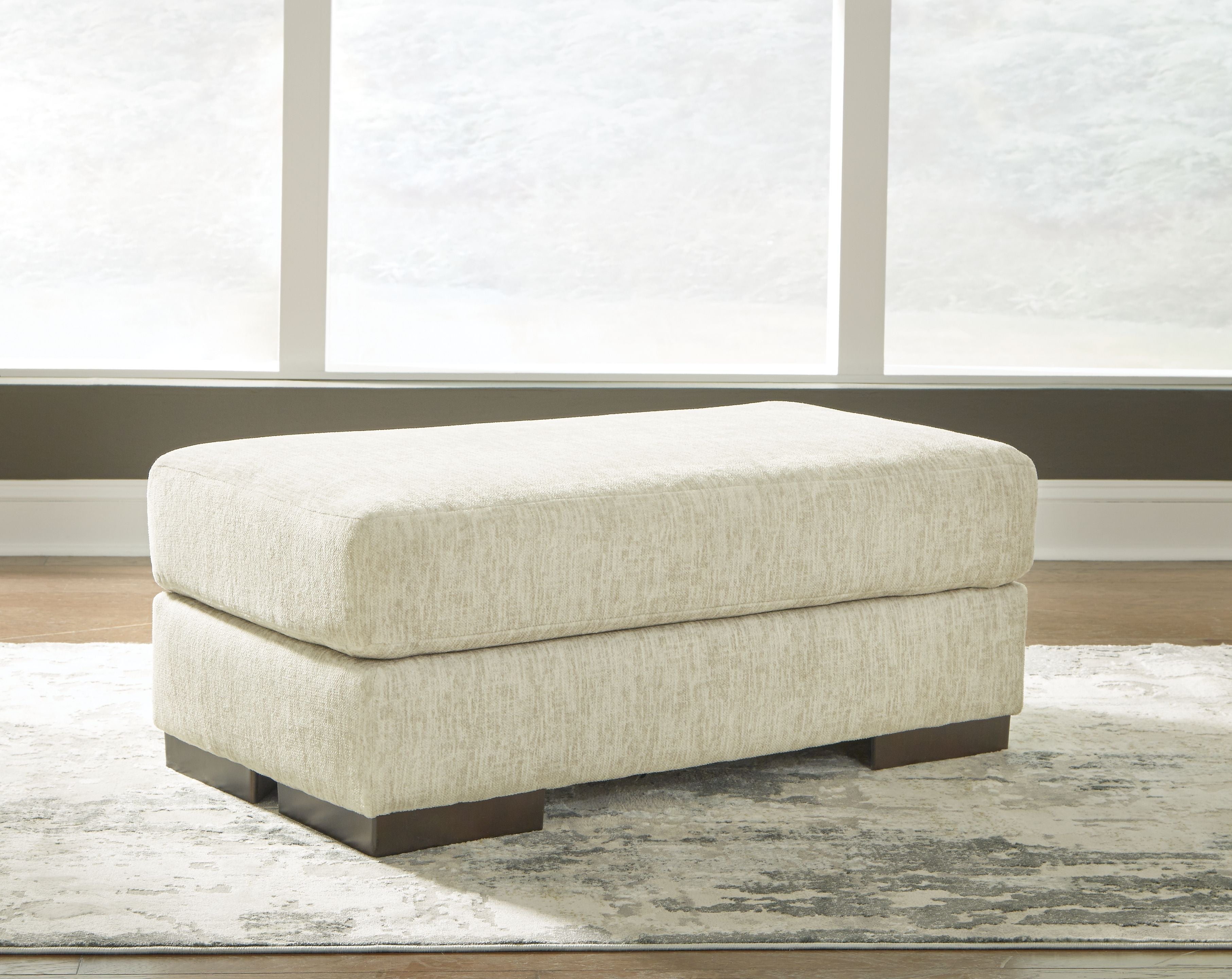 Signature Design by Ashley® Caretti - Parchment - Ottoman | Meri Furniture