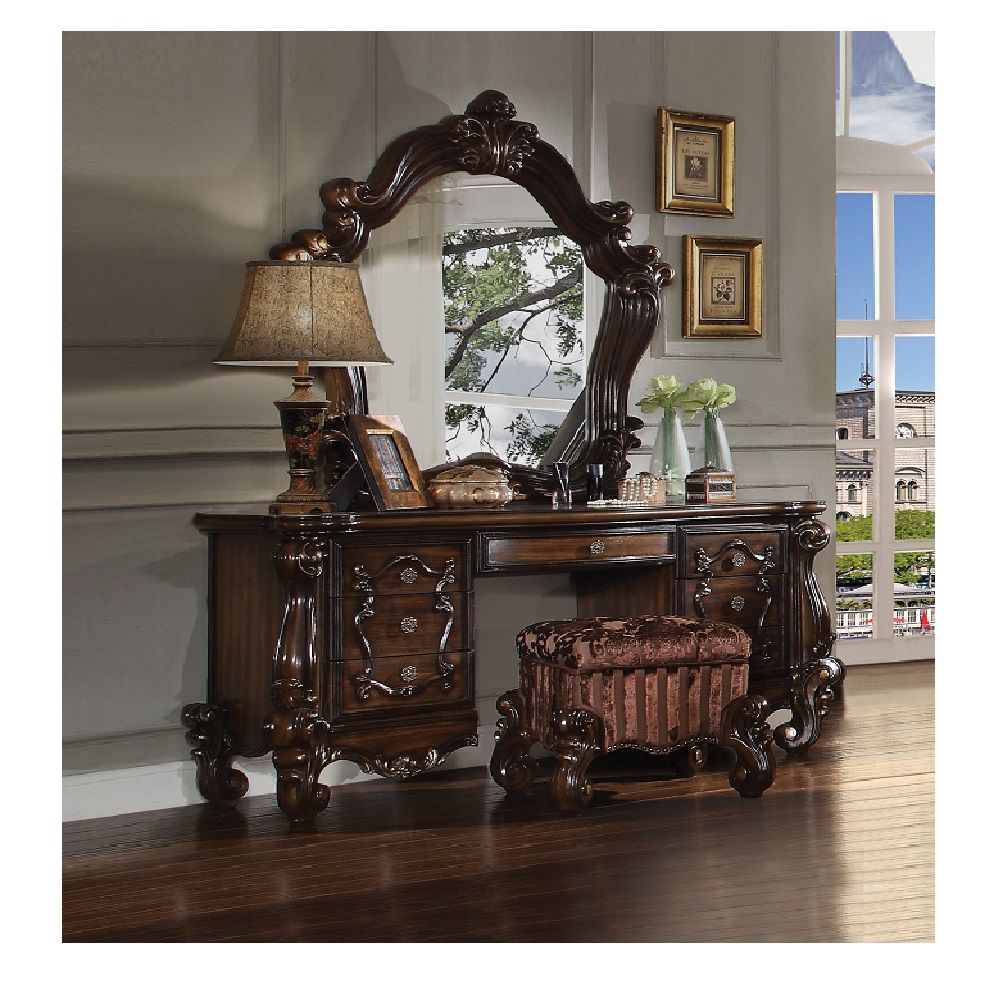 The Versailles mirror gives your bedroom all the grandeur of royal style. This mirror has a substantial silhouette and is adorned with such old-world details, carved medallions, and shaped moldings. This mirror is the perfect addition to any bedroom.