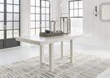 Signature Design by Ashley® Robbinsdale - Rectangular Dining Extension Table | Meri Furniture
