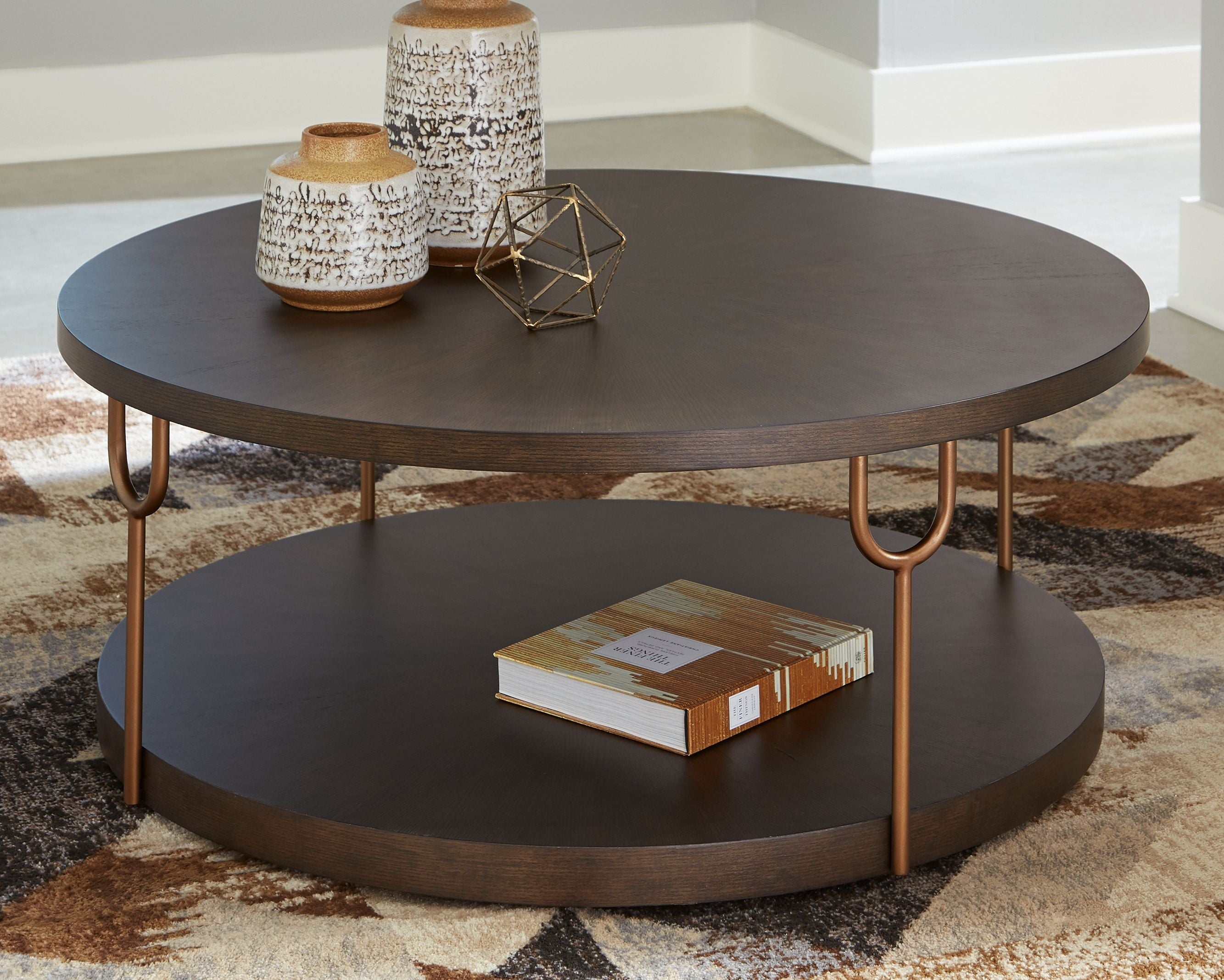 Signature Design by Ashley® Brazburn - Dark Brown / Gold Finish - Round Cocktail Table | Meri Furniture