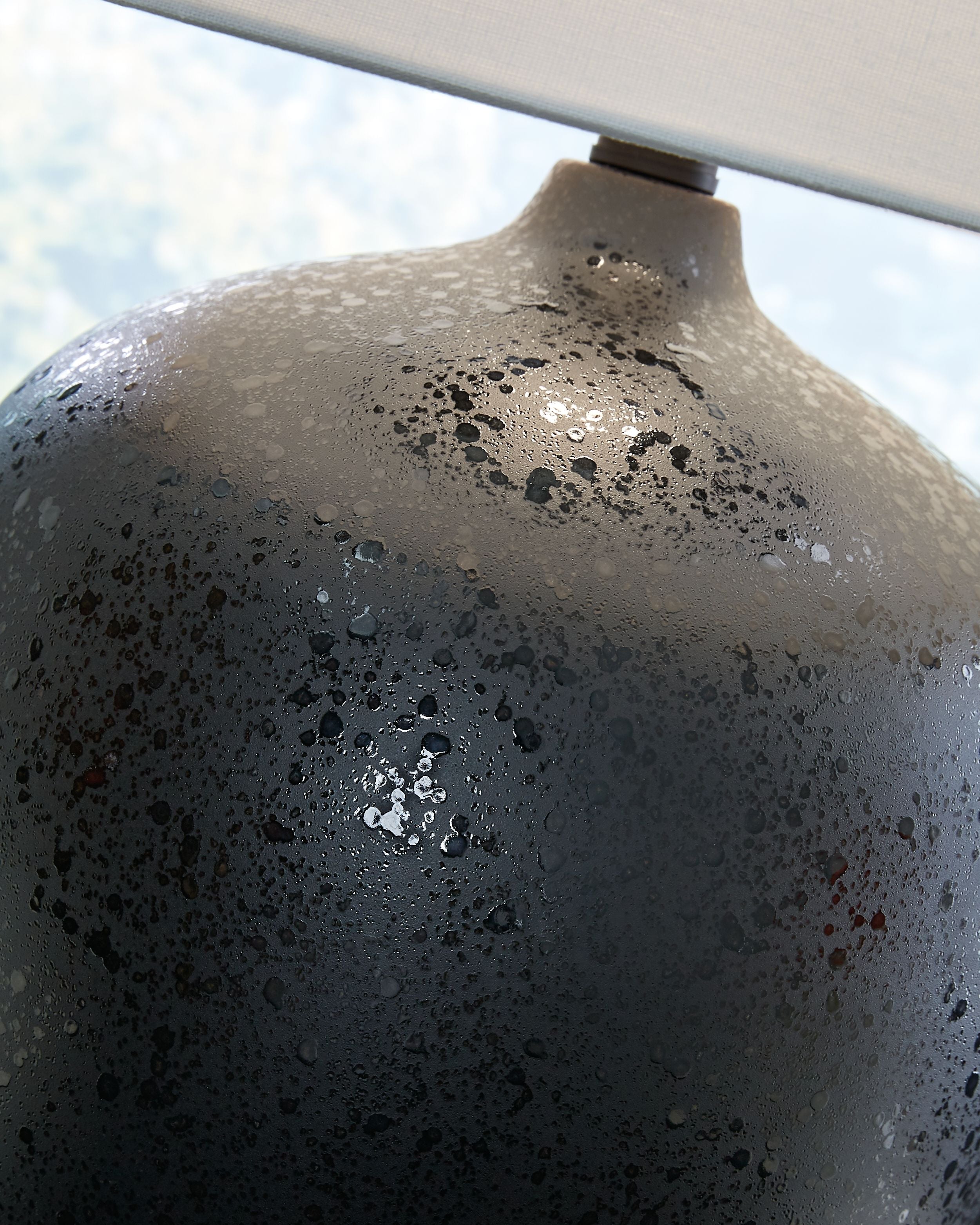 Signature Design by Ashley® Ladstow - Black - Ceramic Table Lamp | Meri Furniture