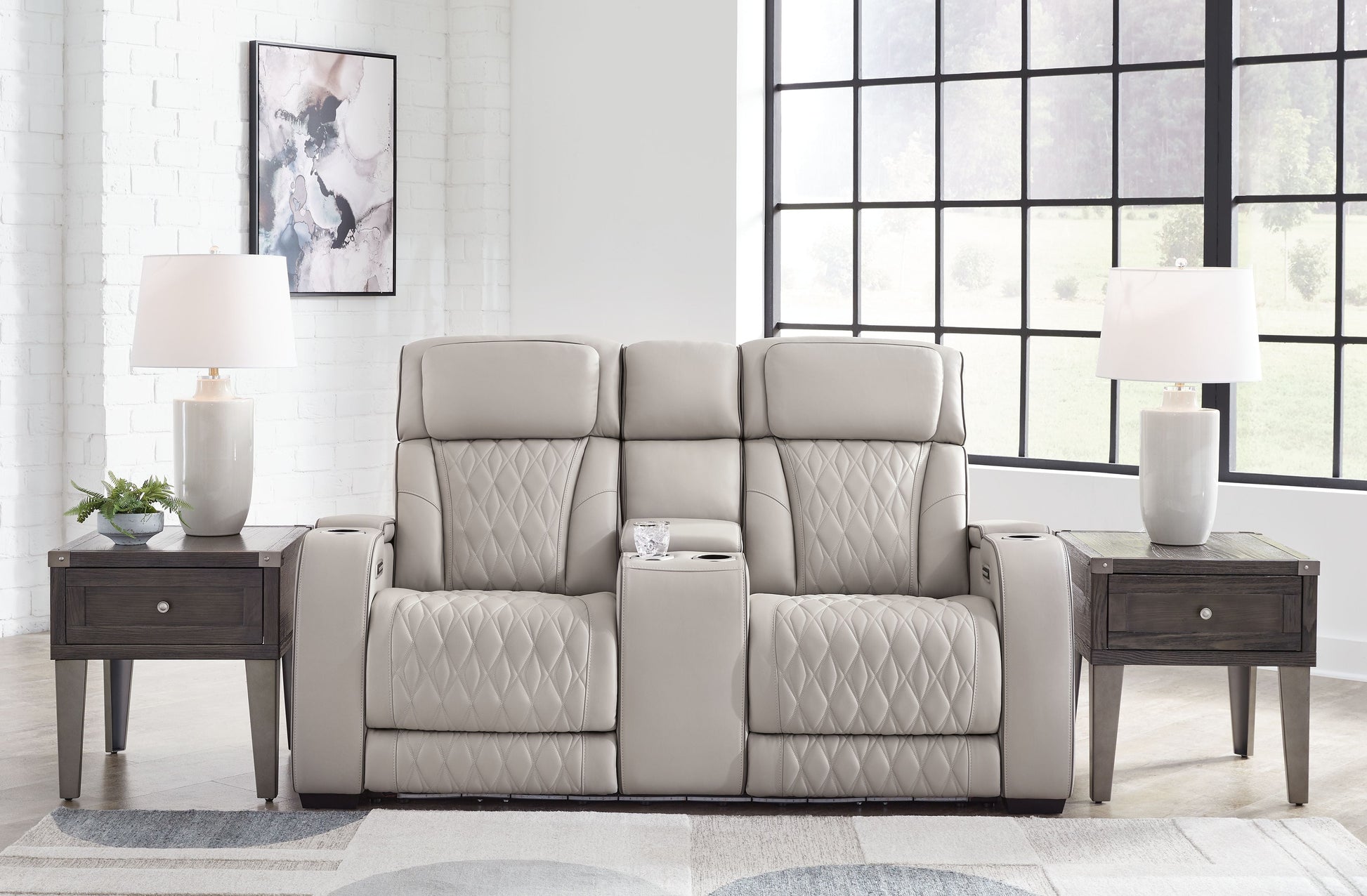 Signature Design by Ashley® Boyington - Power Reclining Loveseat With Console/Adj Hdrst | Meri Furniture