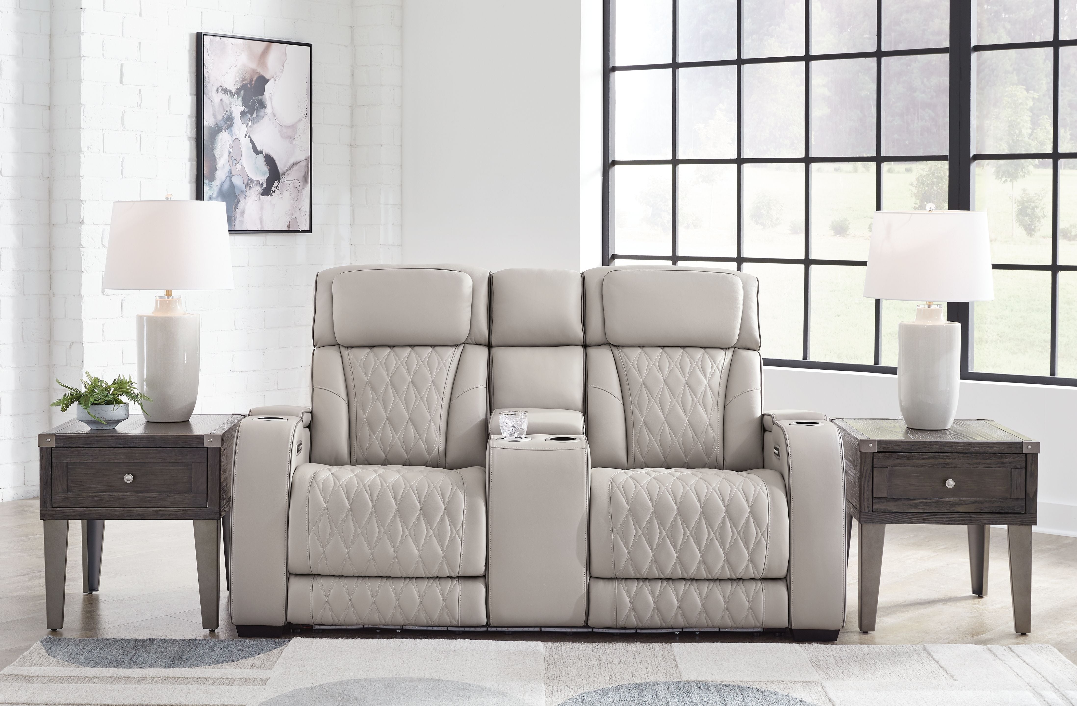 Signature Design by Ashley® Boyington - Power Reclining Loveseat With Console/Adj Hdrst | Meri Furniture