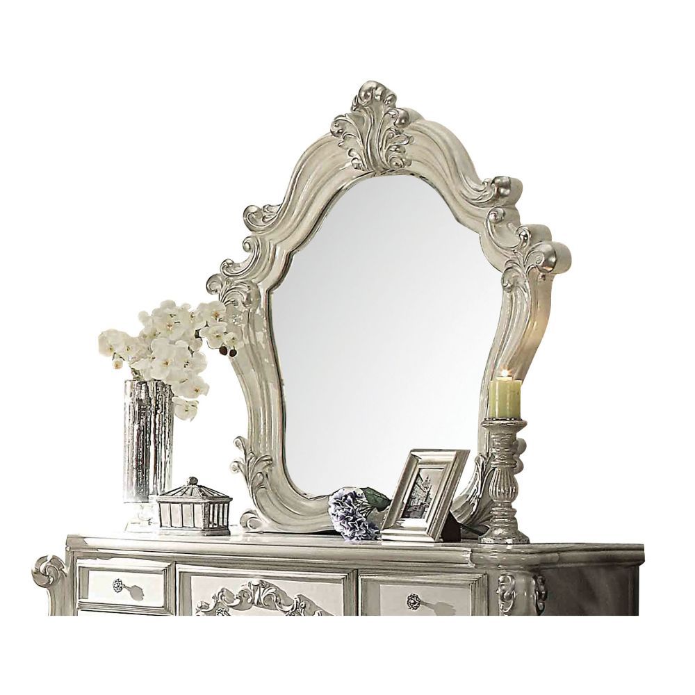 The Versailles mirror gives your bedroom all the grandeur of royal style. This mirror has a substantial silhouette and is adorned with such old-world details, carved medallions, and shaped moldings. This mirror is the perfect addition to any bedroom.