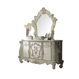 The Versailles mirror gives your bedroom all the grandeur of royal style. This mirror has a substantial silhouette and is adorned with such old-world details, carved medallions, and shaped moldings. This mirror is the perfect addition to any bedroom.