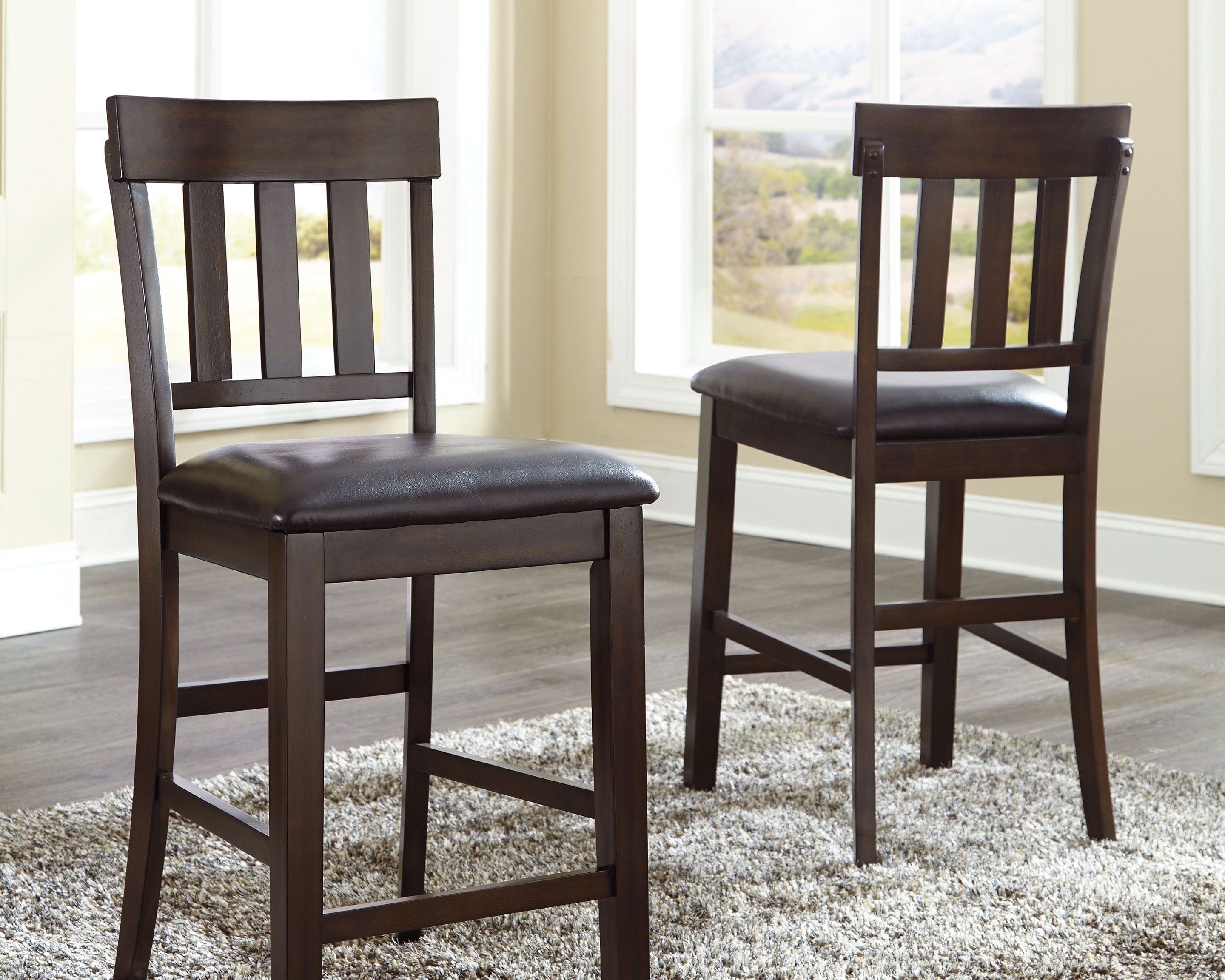 Ashley Furniture Haddigan - Dark Brown - Upholstered Barstool (Set of 2) | Meri Furniture