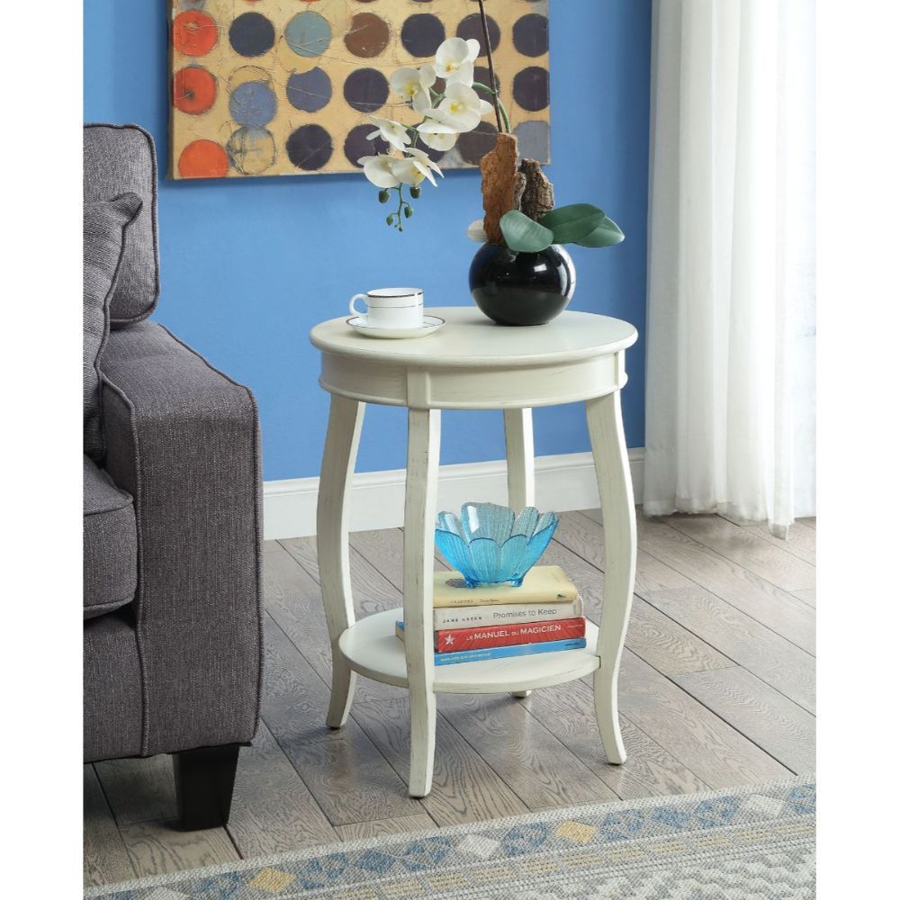 ACME This Alberta side table will be your favorite accent piece with its round top form and stylized legs. Offered in four different colors: Antique White, walnut, red, and teal. One is sure to fit perfect with your style. | Meri Furniture