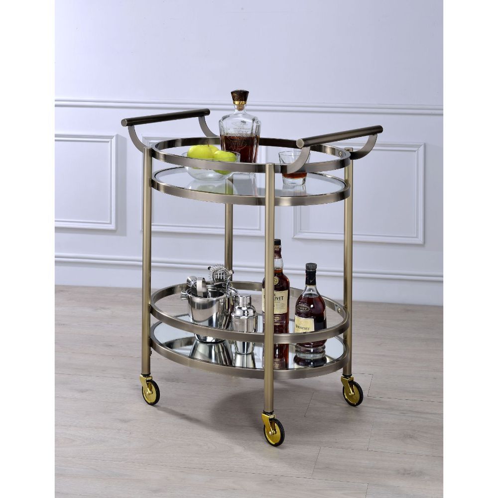 Show off your personality with the Lakelyn serving cart. The clear tempered glass top and mirror bottom are the ideal place for placing your dishes and dining accessories. Roll it where need be on its softer rubber wheels and prepare to entertain.