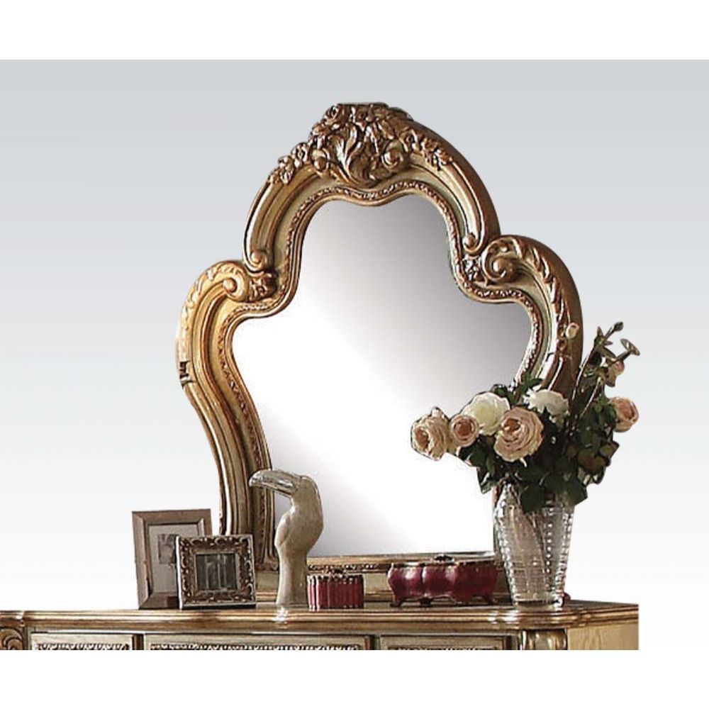 Create an elegant, classy design in your bedroom with the Dresden gold patina and bone mirror. This mirror features a beautiful scrolled frame with beveled edges. Add this mirror to any other piece from this collection to create the perfect bedroom.