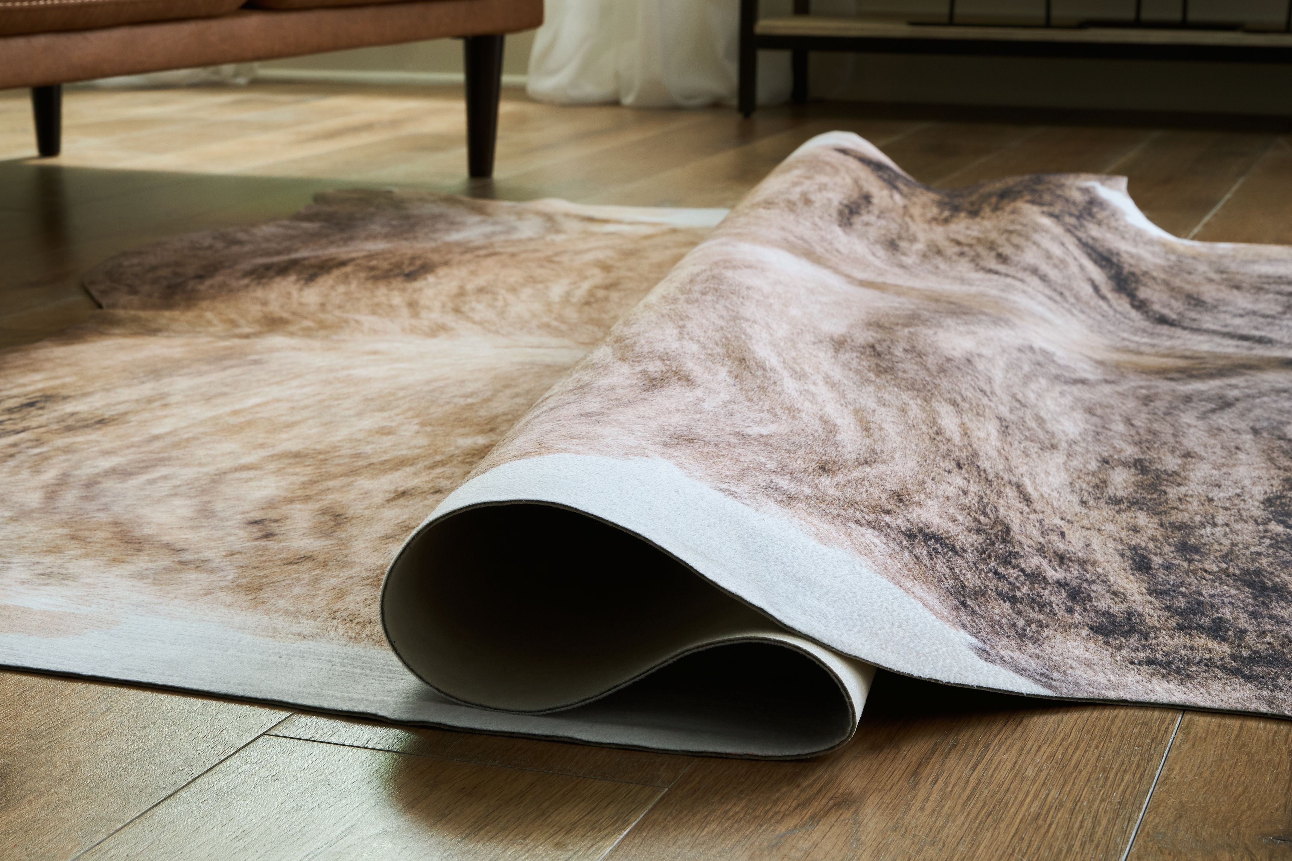 Signature Design by Ashley® Sportsmen - Brown - Medium Rug | Meri Furniture