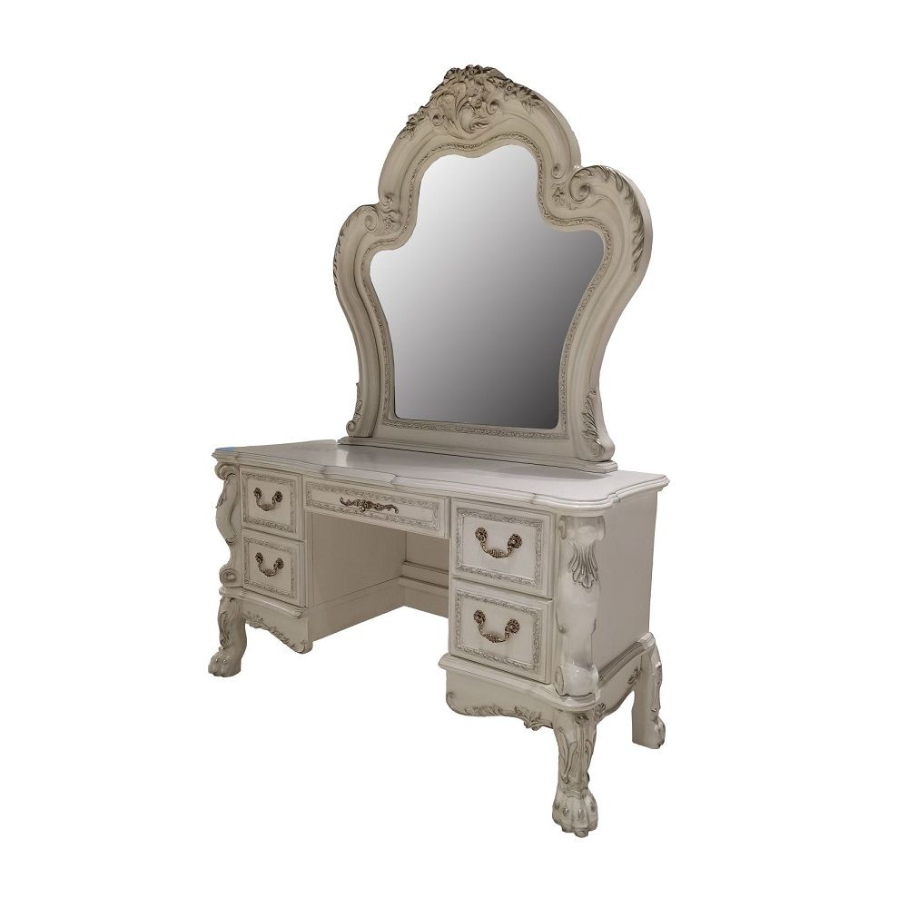 Create an elegant, classy design in your bedroom with the Dresden gold patina and bone mirror. This mirror features a beautiful scrolled frame with beveled edges. Add this mirror to any other piece from this collection to create the perfect bedroom.