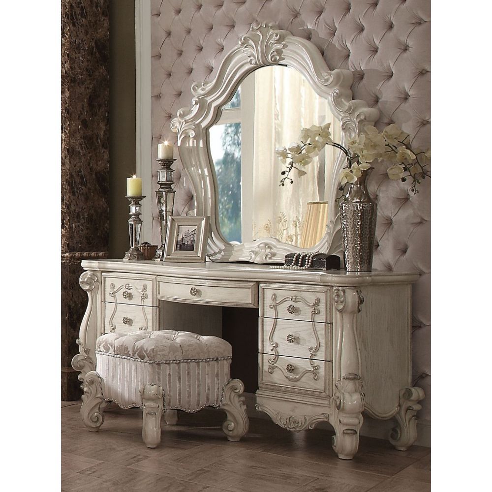 ACME The Versailles mirror gives your bedroom all the grandeur of royal style. This mirror has a substantial silhouette and is adorned with such old-world details, carved medallions, and shaped moldings. This mirror is the perfect addition to any bedroom.