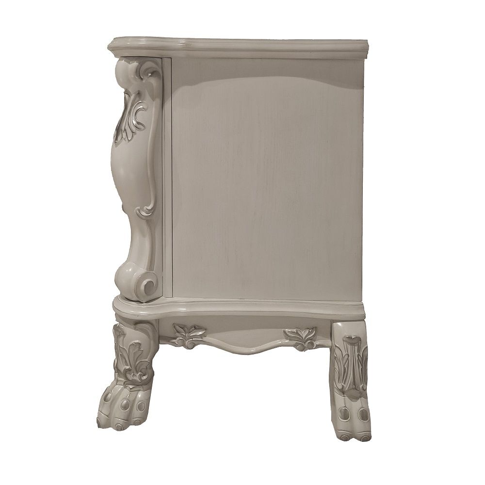 ACME The Dresden Nightstand offers beautiful craftsmanship and artistic carvings. It features solid hardwood with two drawers for storage with coordinating carvings. The drawers feature dove tail construction and are decorated with antique brass hardware.
