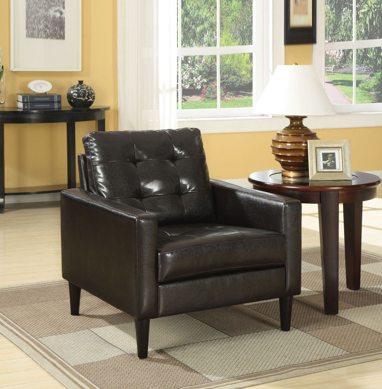 The Balin Upholstered accent chair features strong lines and tufted cushions. The faux leather upholstery is available in Espresso or White Finish. Change your seating and style game with this one piece.