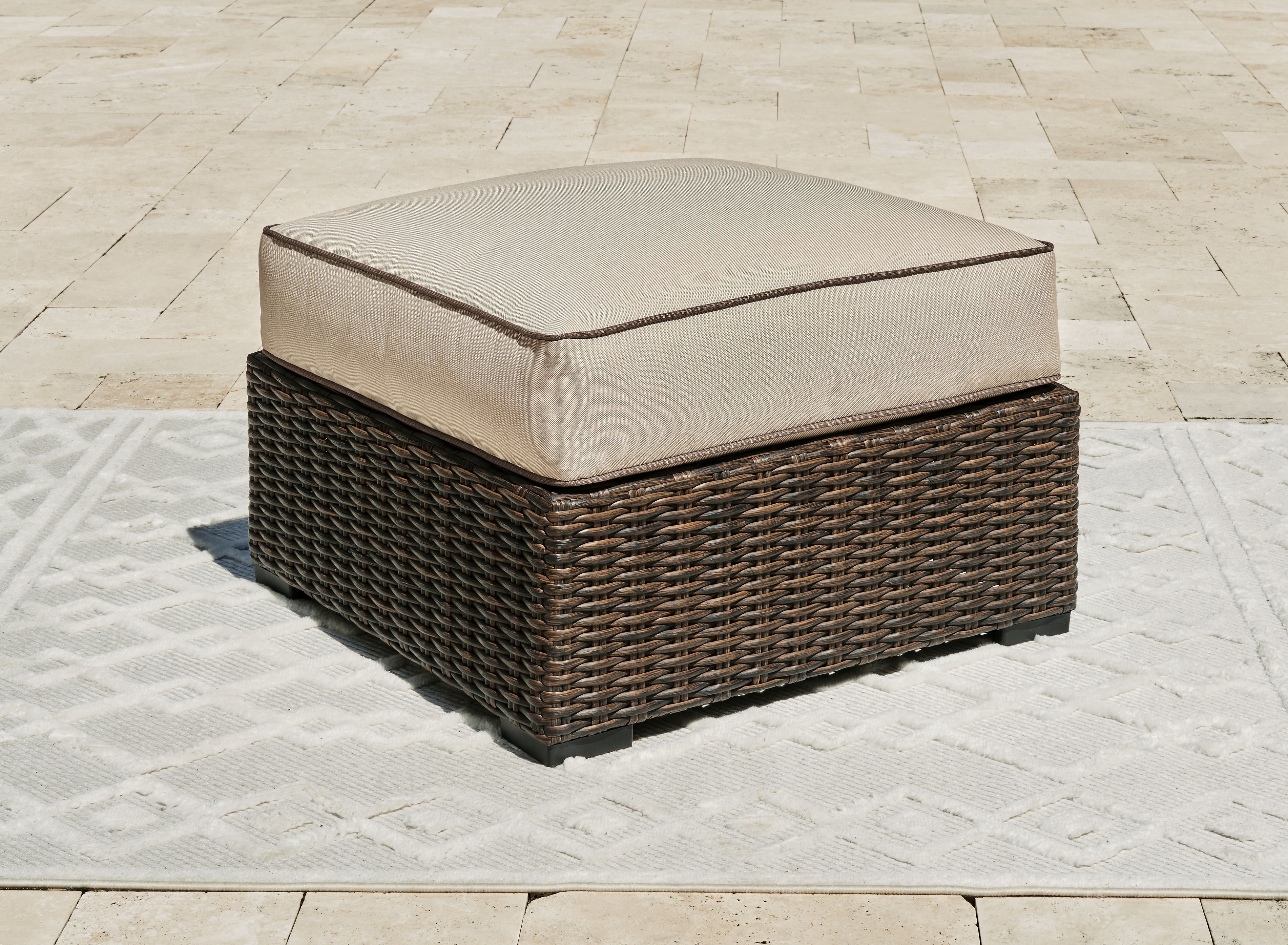 Signature Design by Ashley® Coastline Bay - Brown - Ottoman With Cushion | Meri Furniture