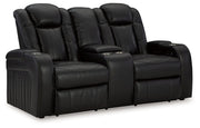 Caveman Den - Power Reclining Loveseat with Console/ Adj Hdrst - Midnight