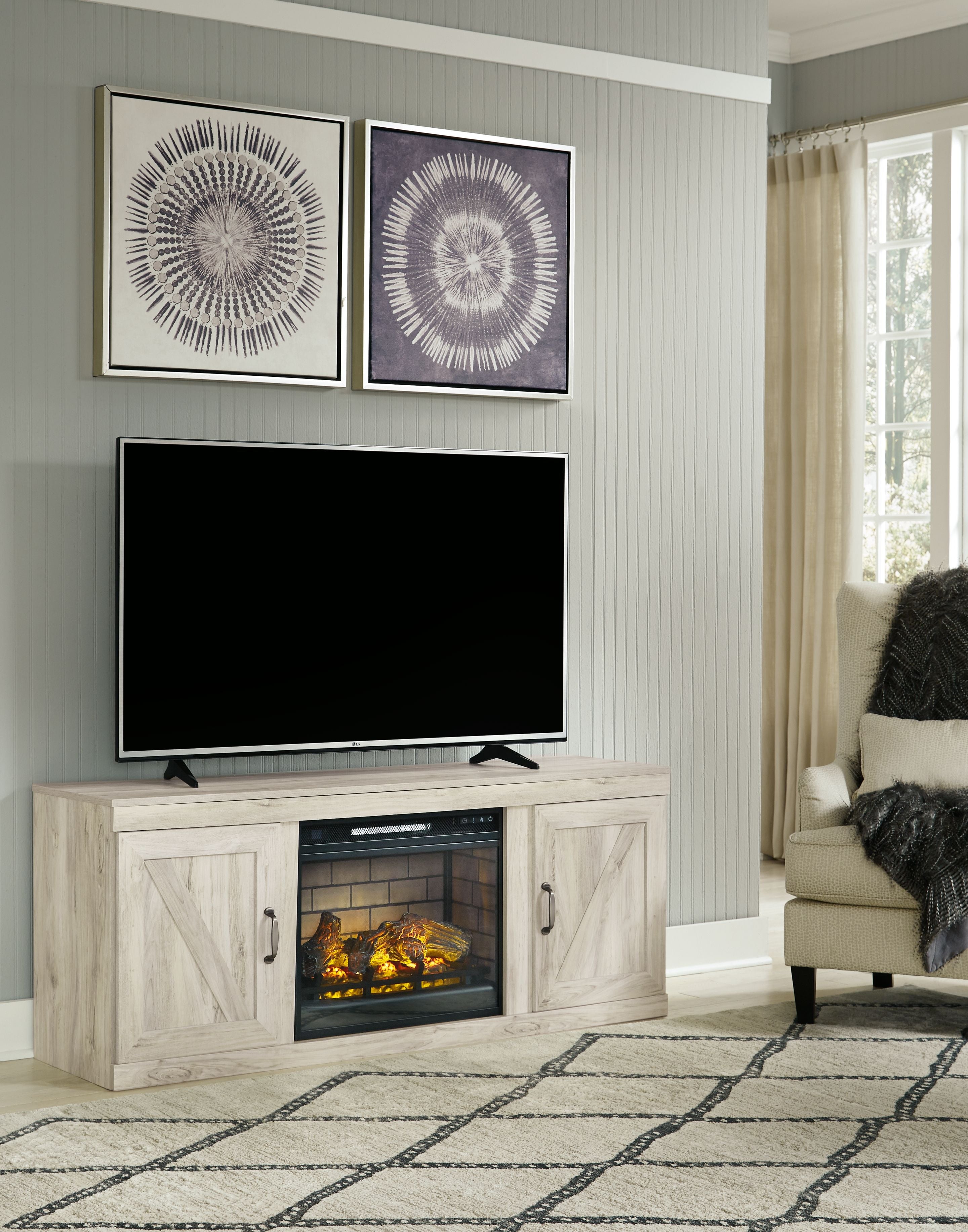 Signature Design by Ashley® Bellaby - Whitewash - TV Stand With Faux Firebrick Fireplace Insert | Meri Furniture