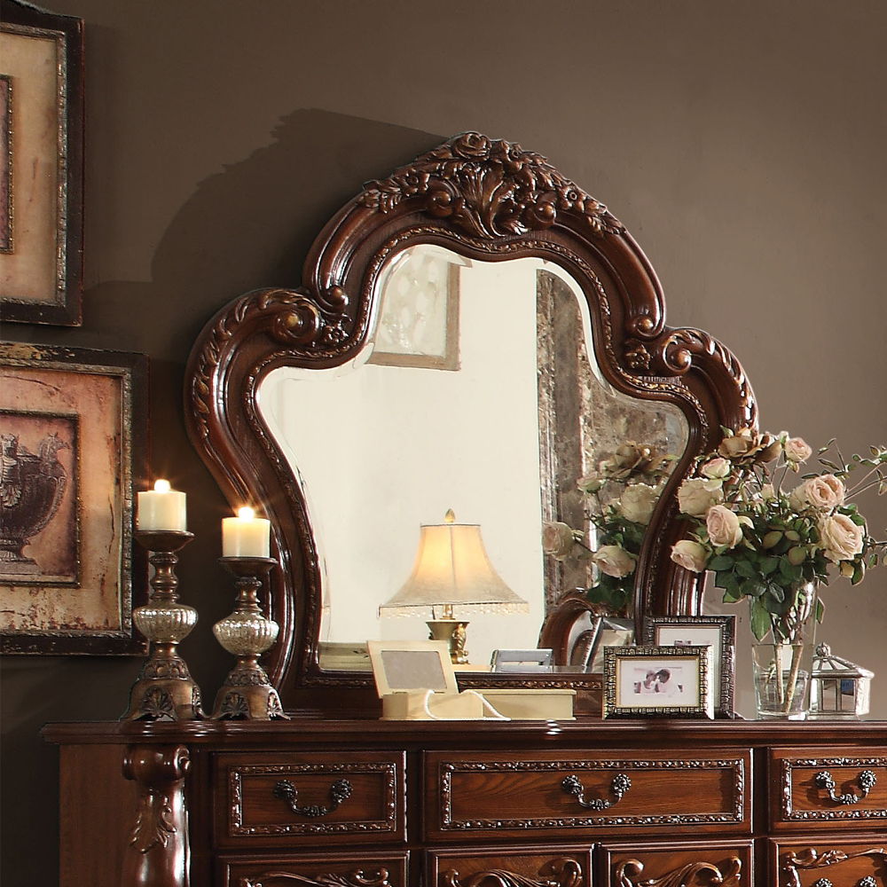 Create an elegant, classy design in your bedroom with the Dresden gold patina and bone mirror. This mirror features a beautiful scrolled frame with beveled edges. Add this mirror to any other piece from this collection to create the perfect bedroom.