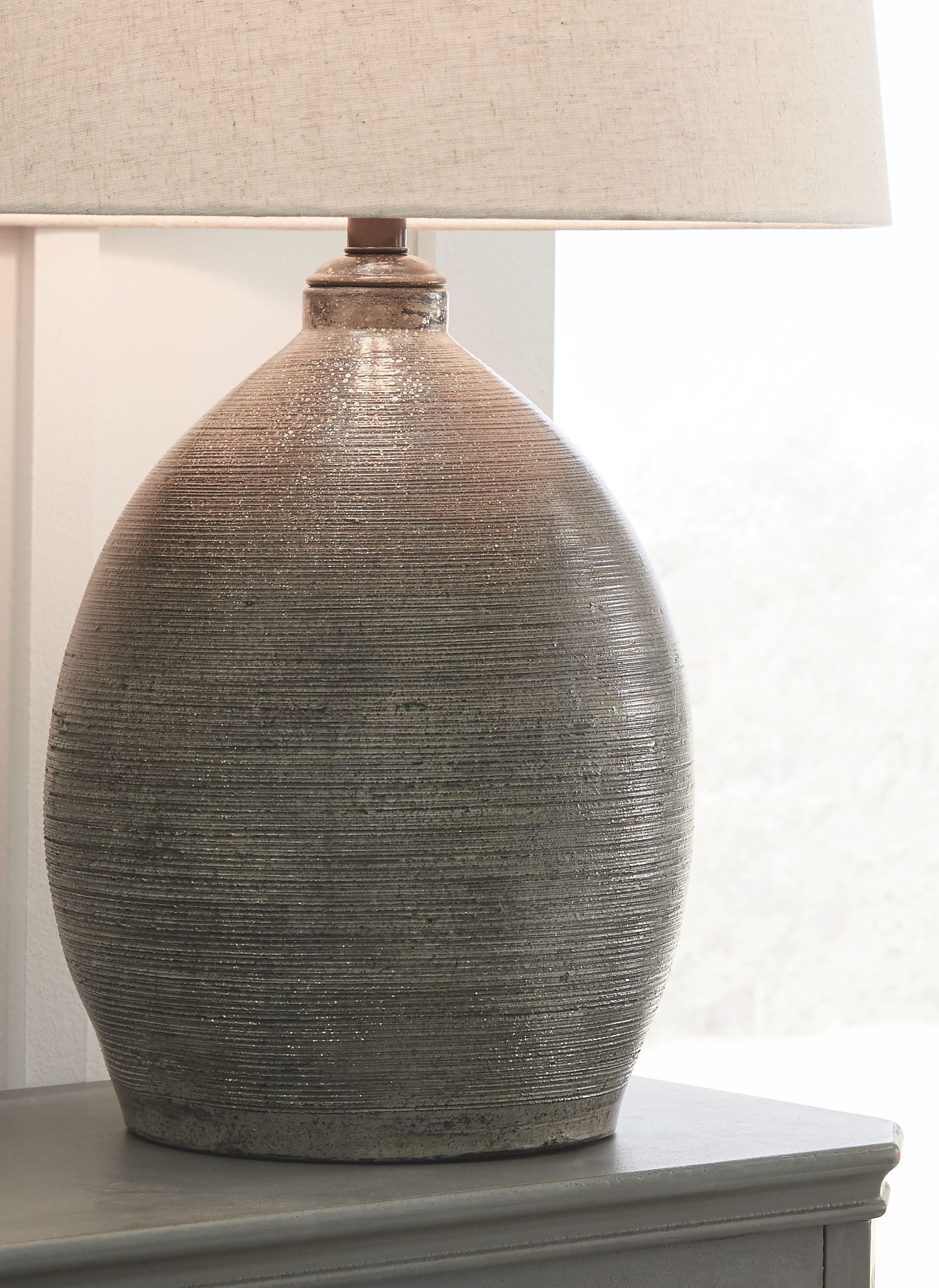 Ashley Furniture Joyelle - Gray - Terracotta Table Lamp | Meri Furniture