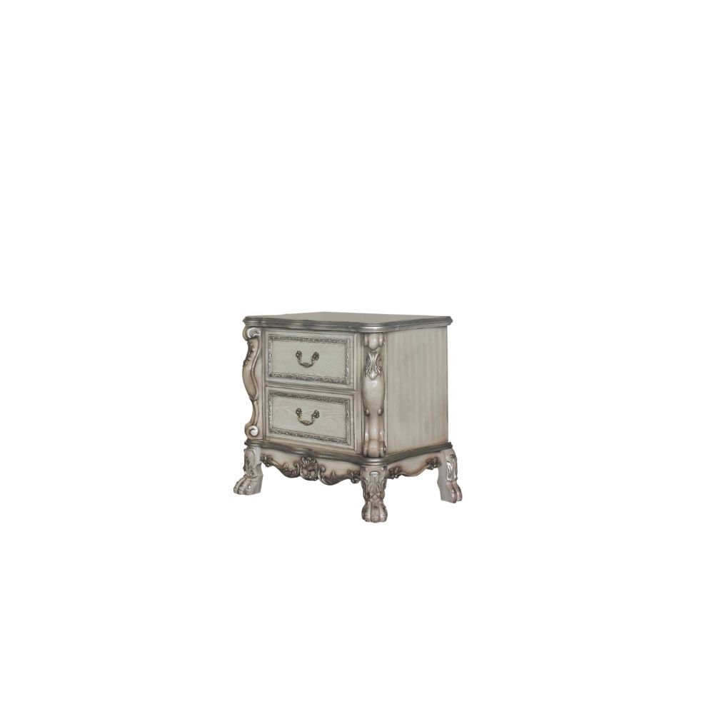 ACME The Dresden Nightstand offers beautiful craftsmanship and artistic carvings. It features solid hardwood with two drawers for storage with coordinating carvings. The drawers feature dove tail construction and are decorated with antique brass hardware.