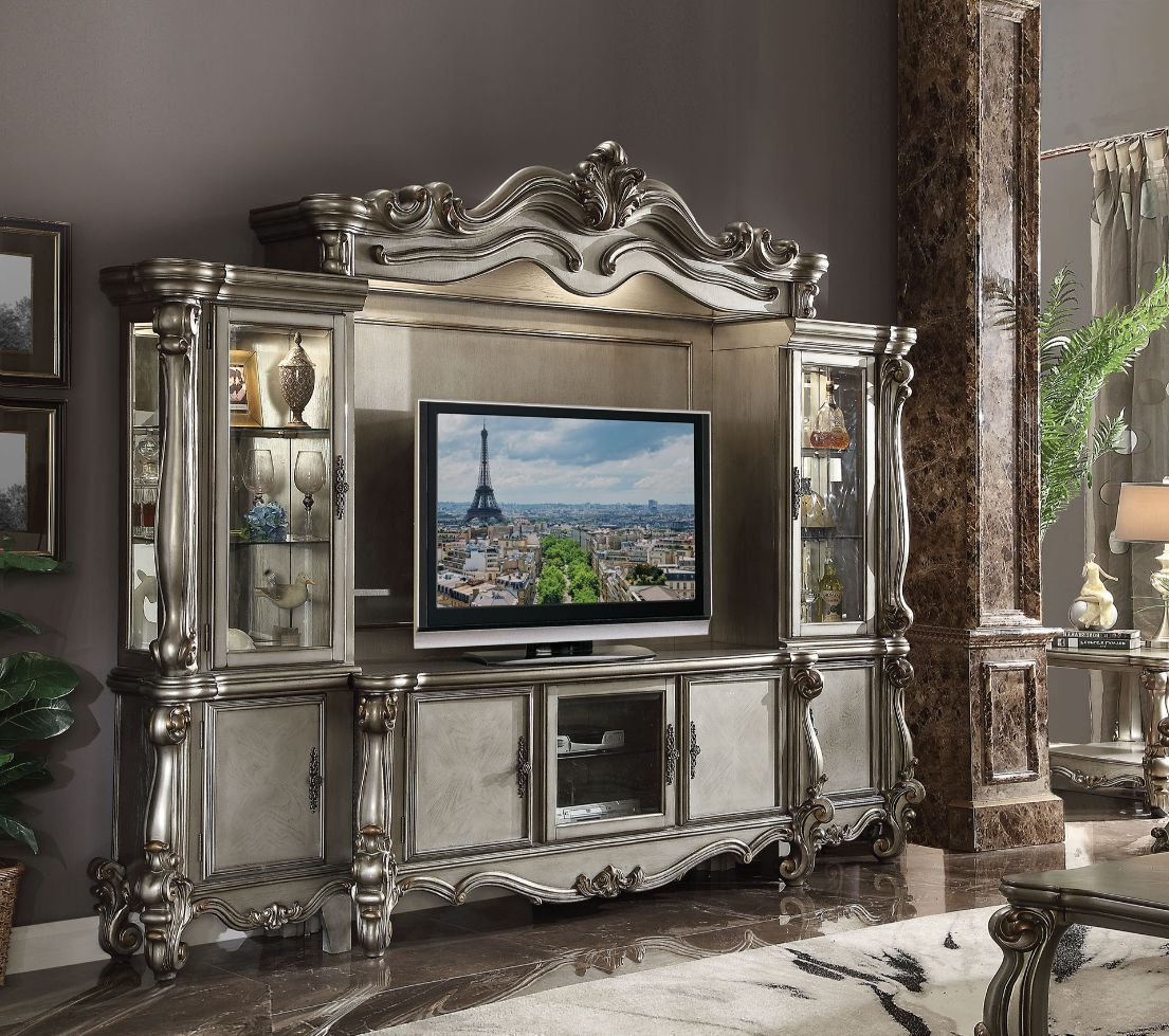 ACME The Versailles the entertainment center was inspired by old European design. This collection features carved scrollwork accent on the bridge's crown. | Meri Furniture
