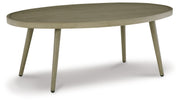 Signature Design by Ashley® Swiss Valley - Beige - Oval Cocktail Table | Meri Furniture