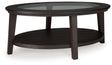 Signature Design by Ashley® Celamar - Dark Brown - Oval Cocktail Table | Meri Furniture