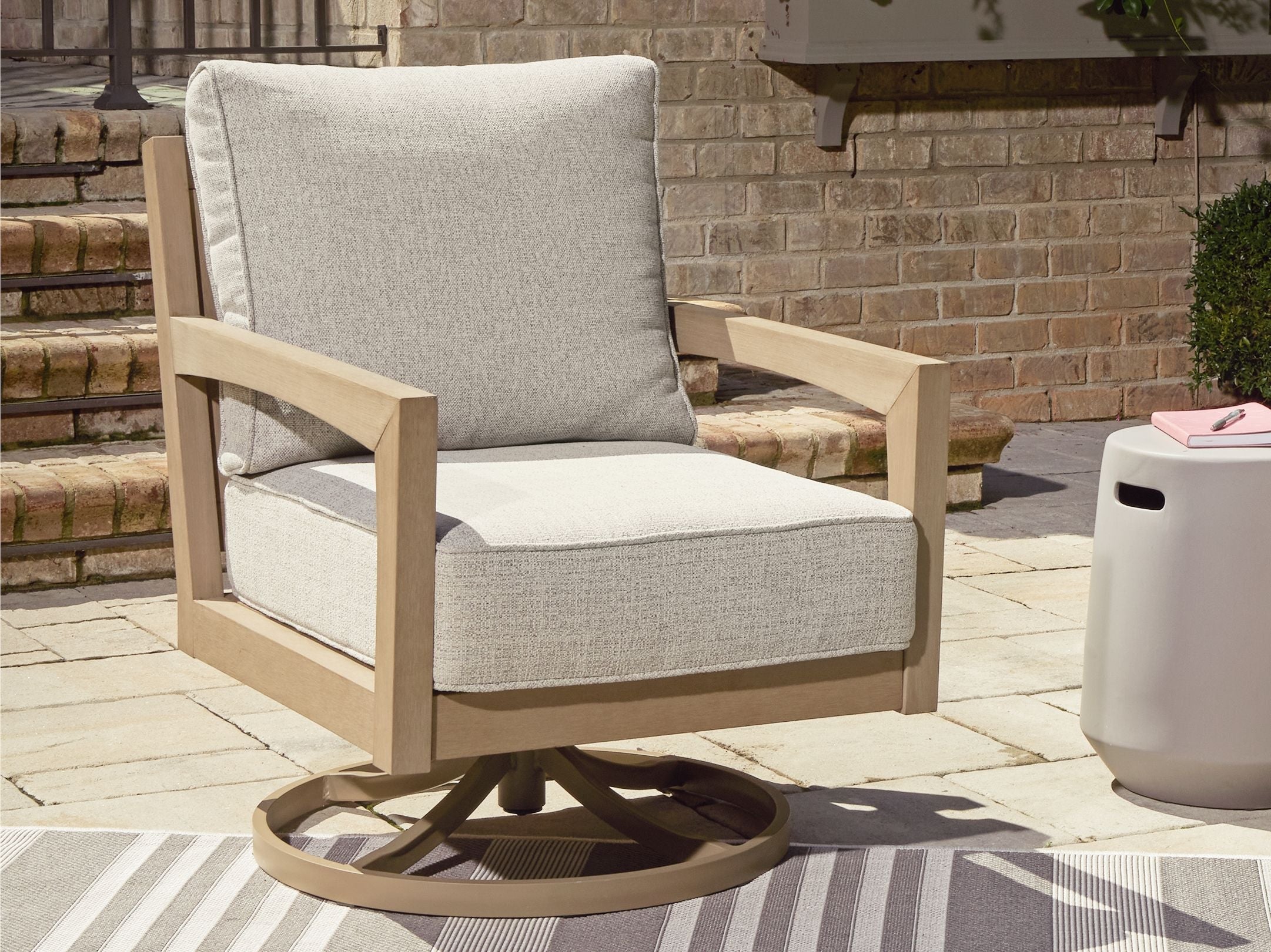 Signature Design by Ashley® Hallow Creek - Driftwood - Swivel Lounge With Cushion | Meri Furniture