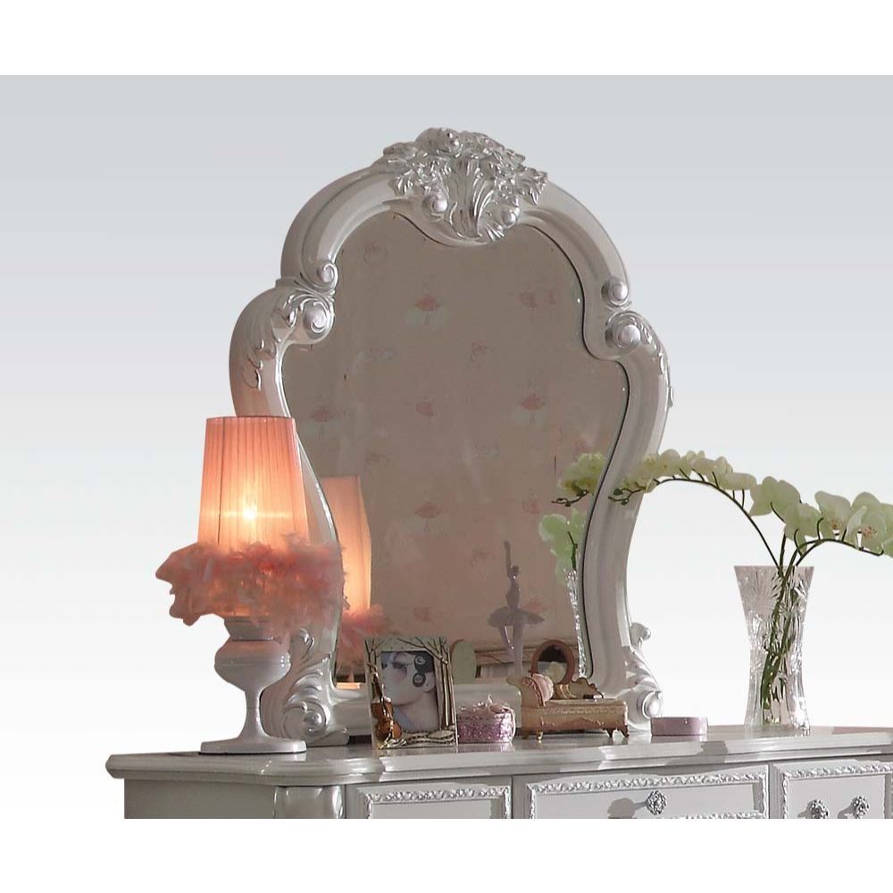 ACME Create an elegant, classy design in your bedroom with the Dresden gold patina and bone mirror. This mirror features a beautiful scrolled frame with beveled edges. Add this mirror to any other piece from this collection to create the perfect bedroom.