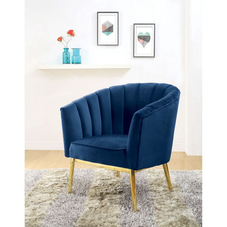 Refined carving with authentic styling, the Colla accent chair is the embodiment of elegance. The thick padded velvet cushion with straight-lined detailing offers superior coziness.