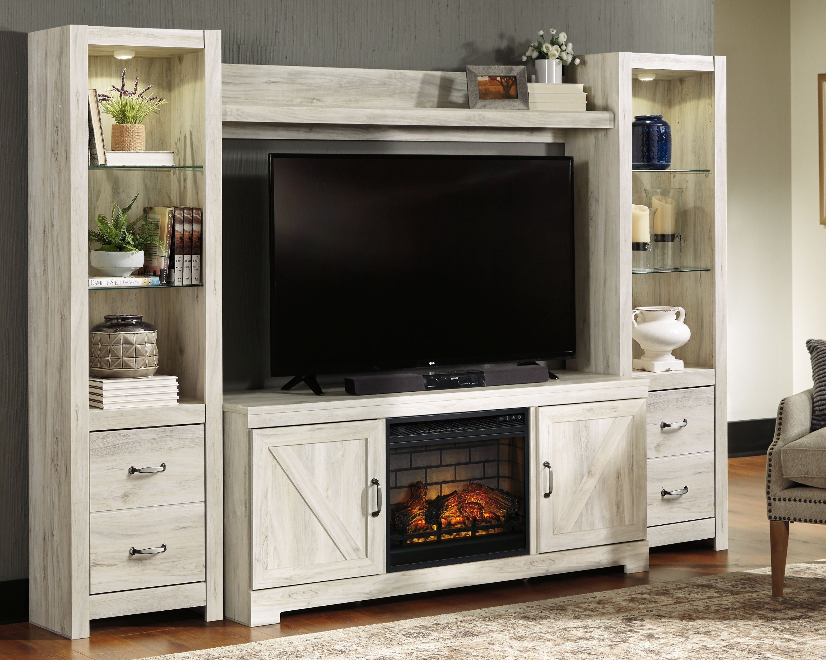 Signature Design by Ashley® Bellaby - Whitewash - Entertainment Center - TV Stand With Faux Firebrick Fireplace Insert | Meri Furniture