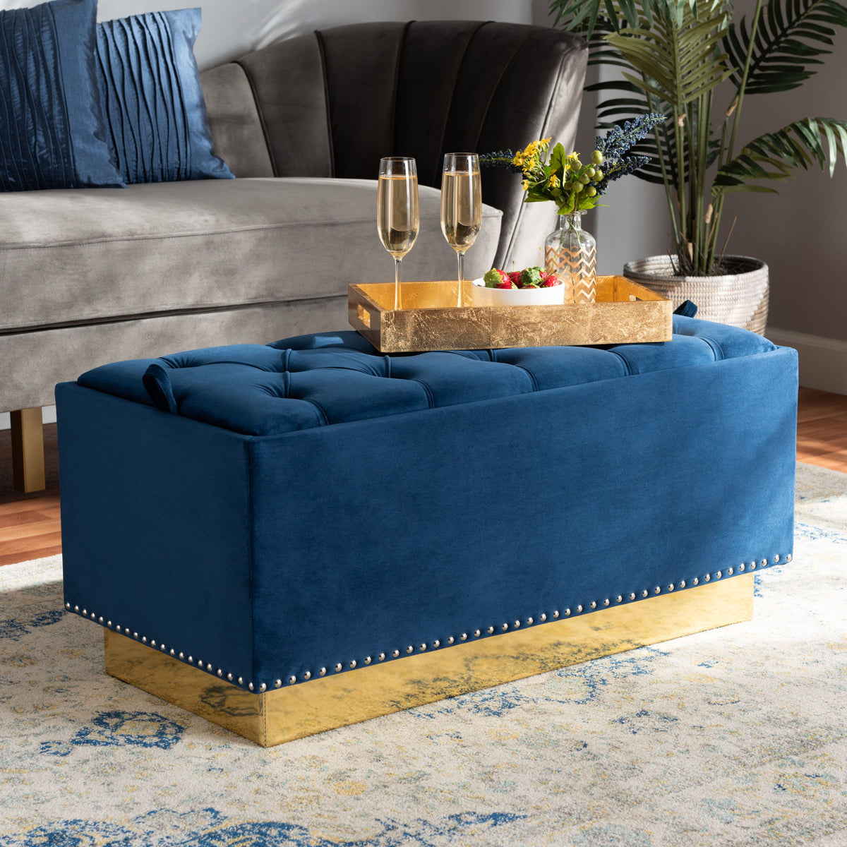 Powell Glam and Luxe Navy Blue Velvet Fabric Upholstered and Gold PU Leather Storage Ottoman