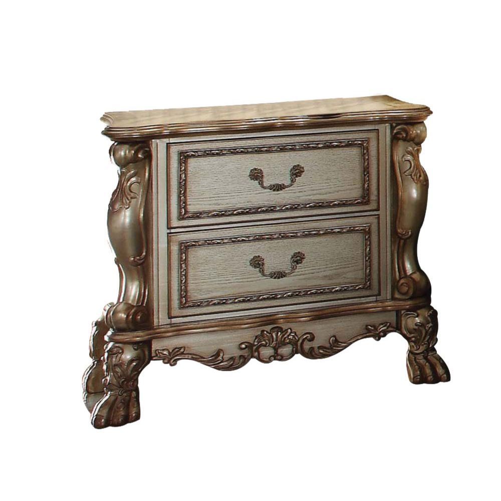 ACME The Dresden Nightstand offers beautiful craftsmanship and artistic carvings. It features solid hardwood with two drawers for storage with coordinating carvings. The drawers feature dove tail construction and are decorated with antique brass hardware.