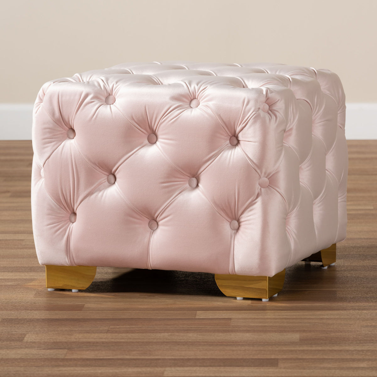 Avara Glam and Luxe Light Pink Velvet Fabric Upholstered Gold Finished Button Tufted Ottoman