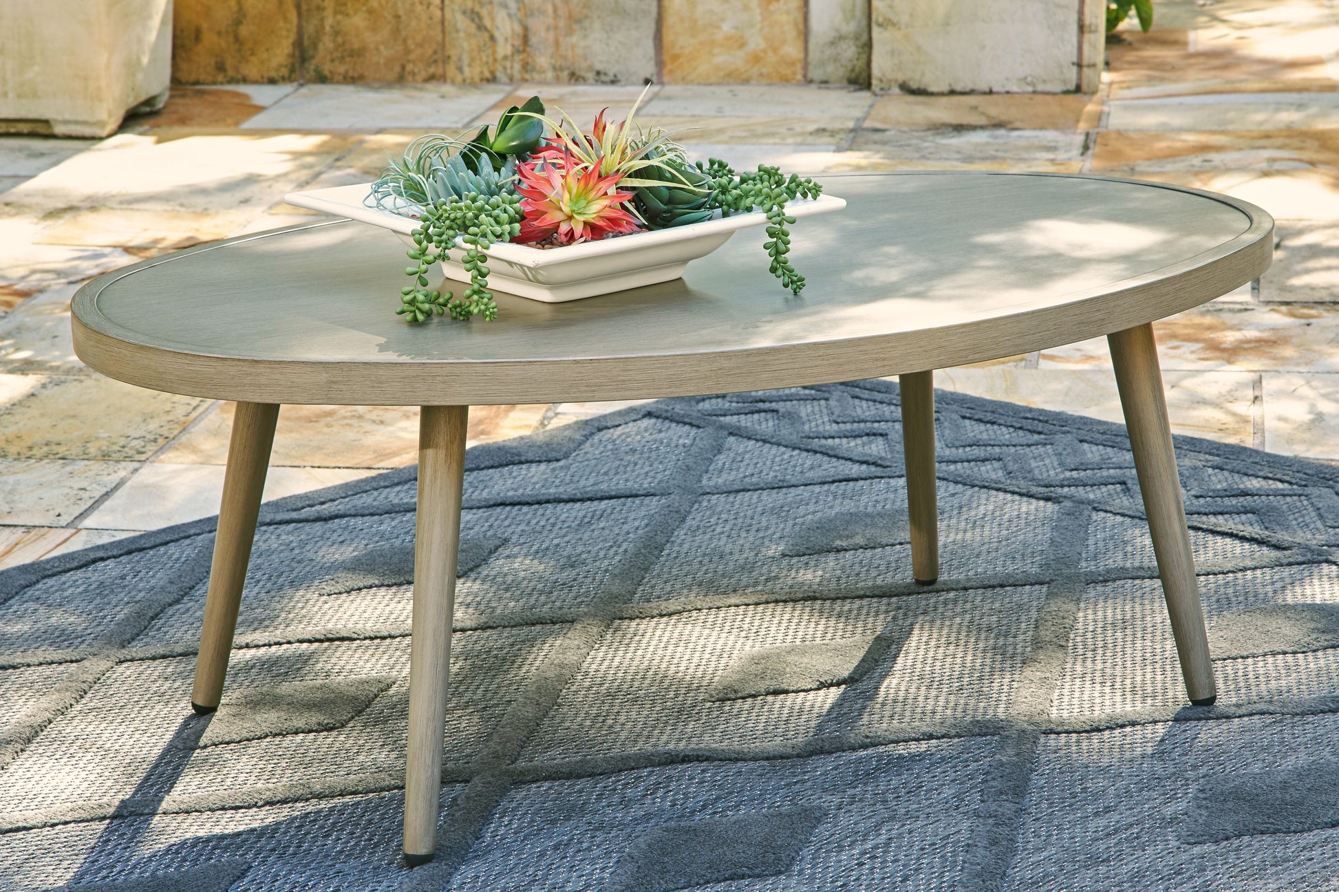 Signature Design by Ashley® Swiss Valley - Beige - Oval Cocktail Table | Meri Furniture