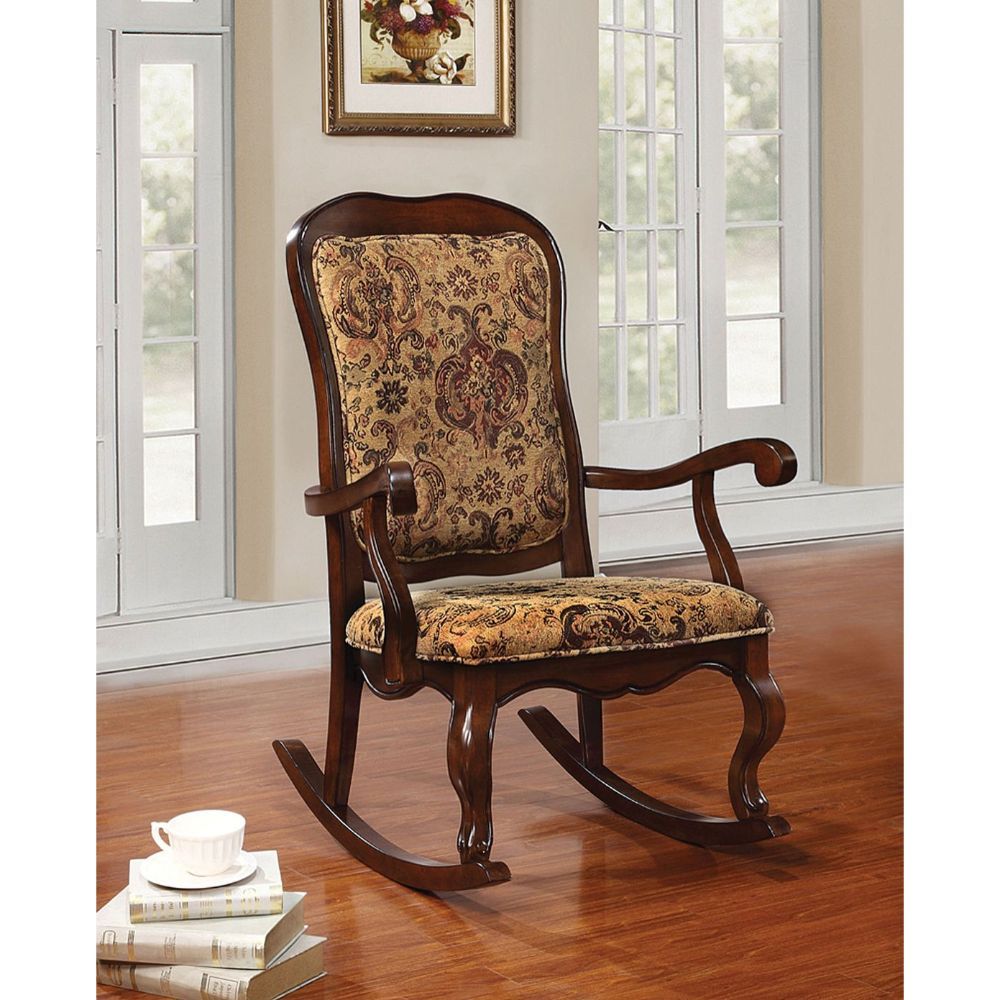 The Sharan rocking chair features a French provincial style with scalloped apron, cabriole front legs, expertly crafted in antique finish.