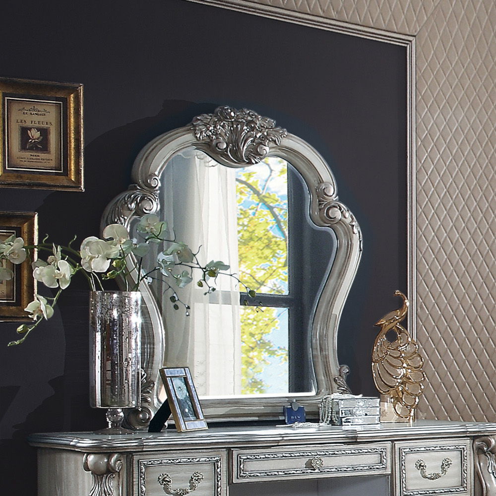 ACME Create an elegant, classy design in your bedroom with the Dresden gold patina and bone mirror. This mirror features a beautiful scrolled frame with beveled edges. Add this mirror to any other piece from this collection to create the perfect bedroom.