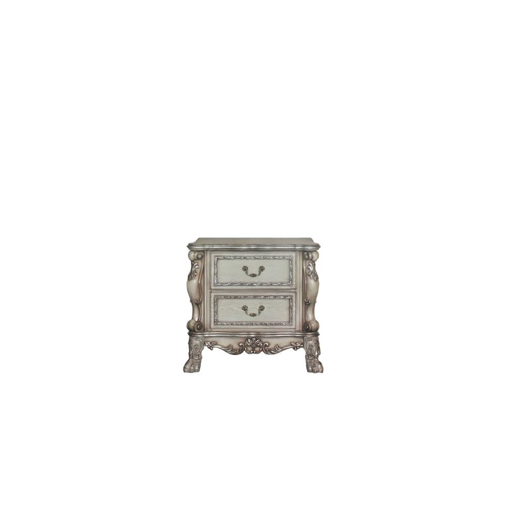 ACME The Dresden Nightstand offers beautiful craftsmanship and artistic carvings. It features solid hardwood with two drawers for storage with coordinating carvings. The drawers feature dove tail construction and are decorated with antique brass hardware.