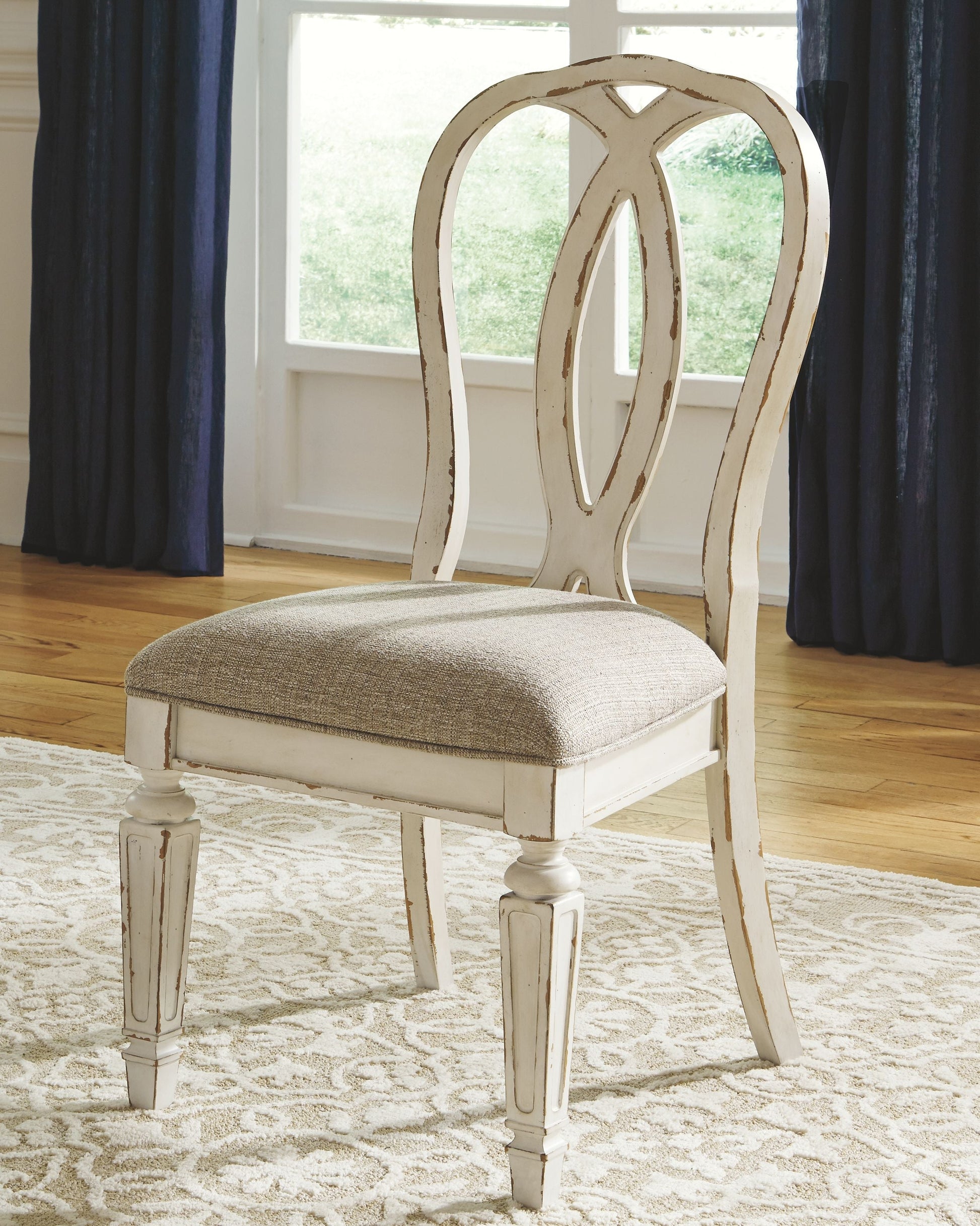 Signature Design by Ashley® Realyn - Oval Dining Table Set | Meri Furniture