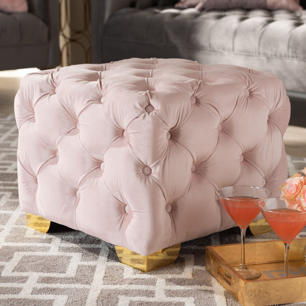 Avara Glam and Luxe Light Pink Velvet Fabric Upholstered Gold Finished Button Tufted Ottoman