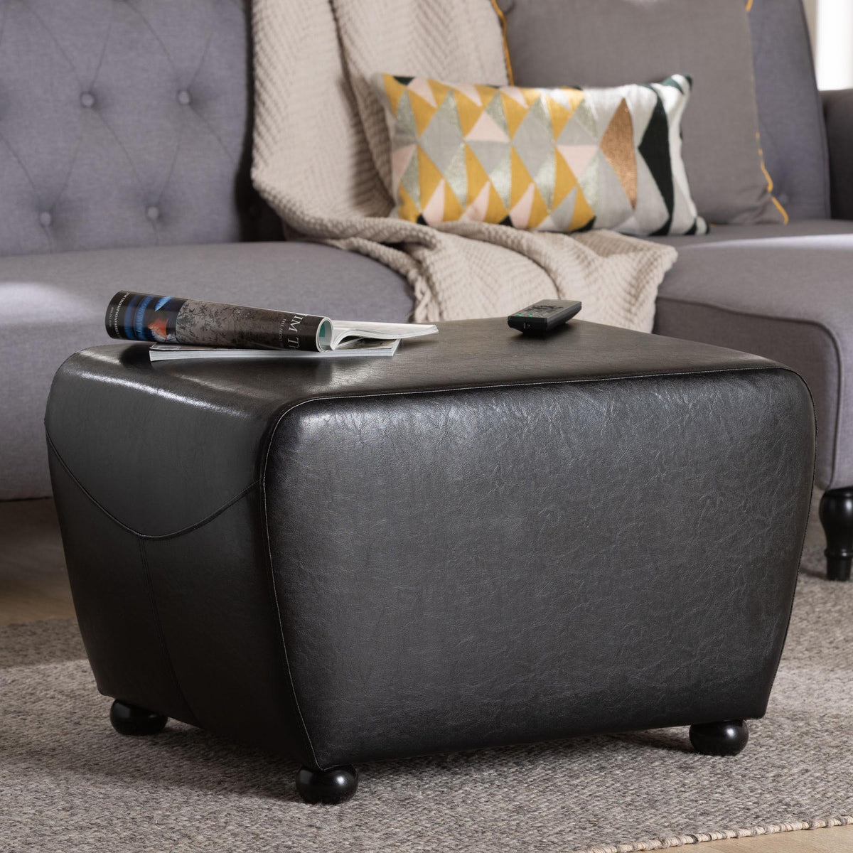 Black Faux Leather Ottoman with Rounded Sides