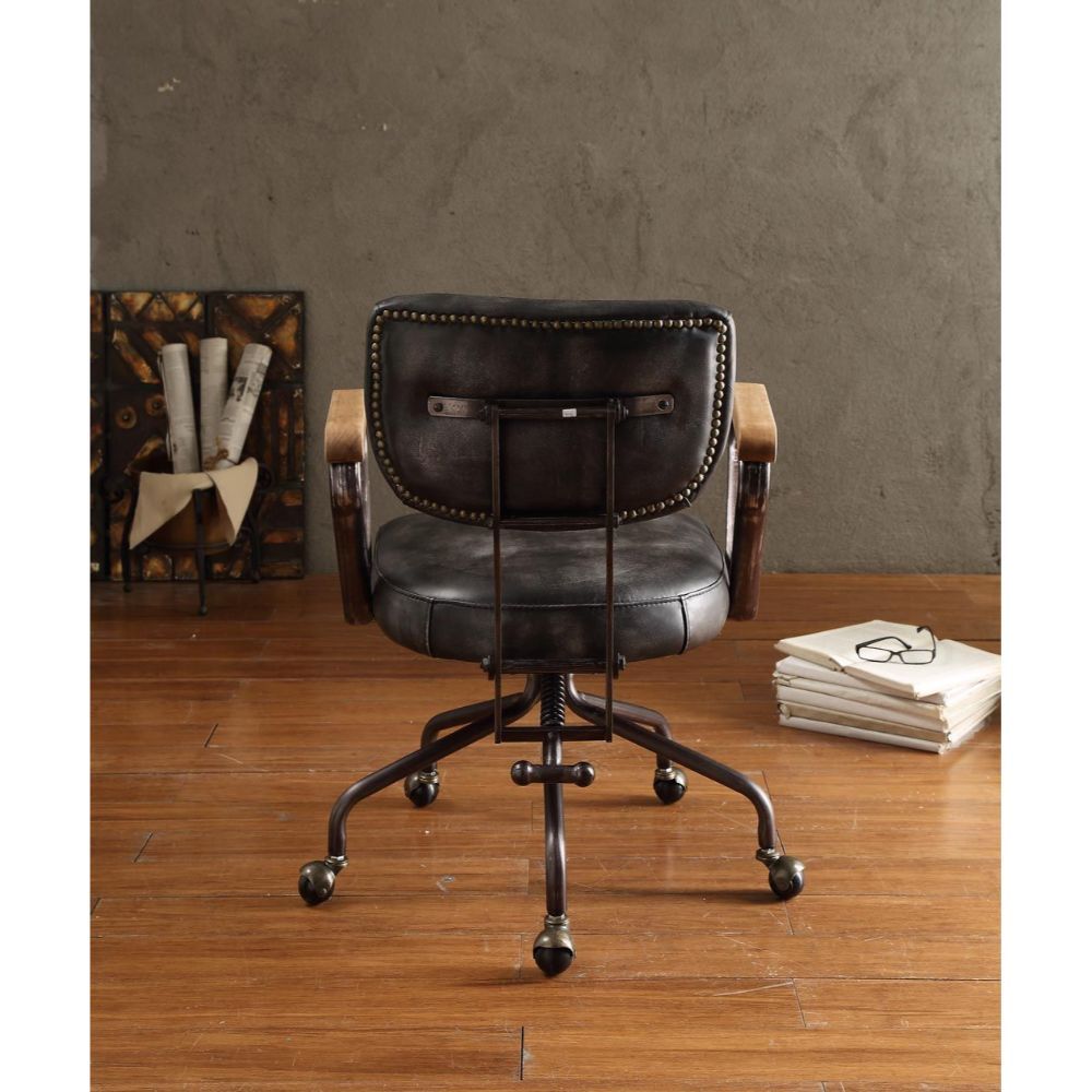 Our durable Hallie office chair gets its industrial look from oversized button tufted back and vintage top grain leather. The 5-star swivel base fitted with casters, it keeps you moving from one task to the next. Some Assembly Required.